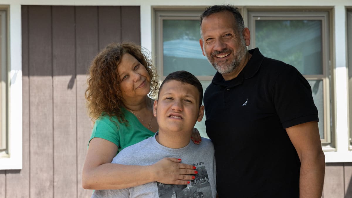 Hunter—pictured here with his parents, Stephanie and Frank—enjoyed a uniquely personalized experience at Camp Sno-Mo in the summer of 2023.