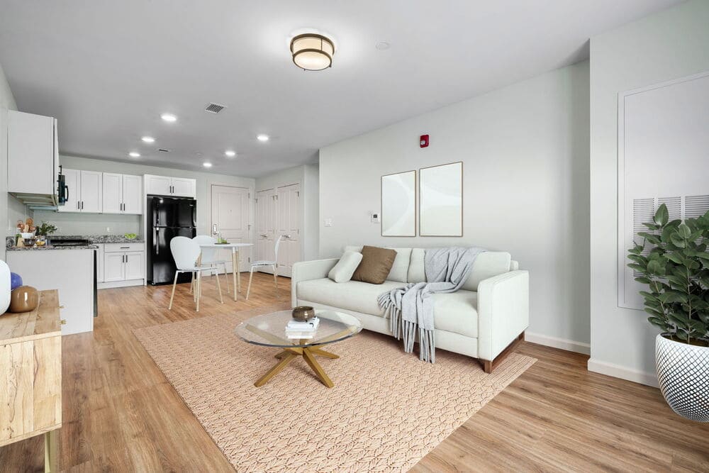 View of an apartments living room and kitchen area