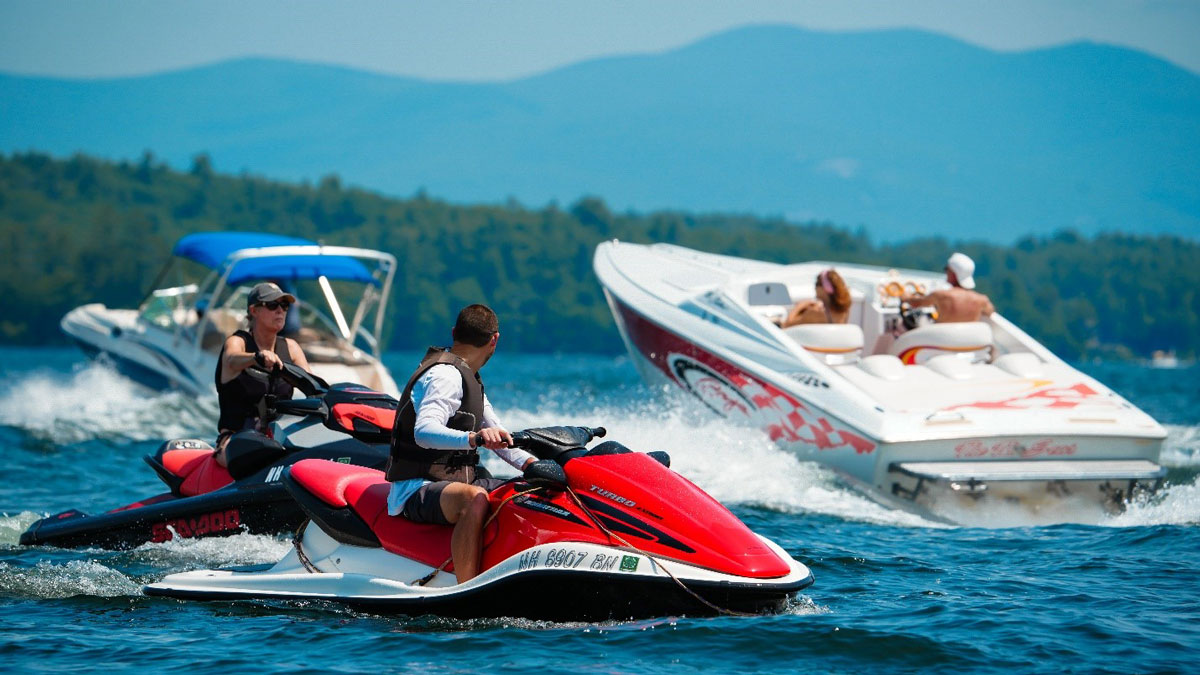Jet ski and boats on Lake Winnipesaukee during the Easterseals NH Poker Run event.