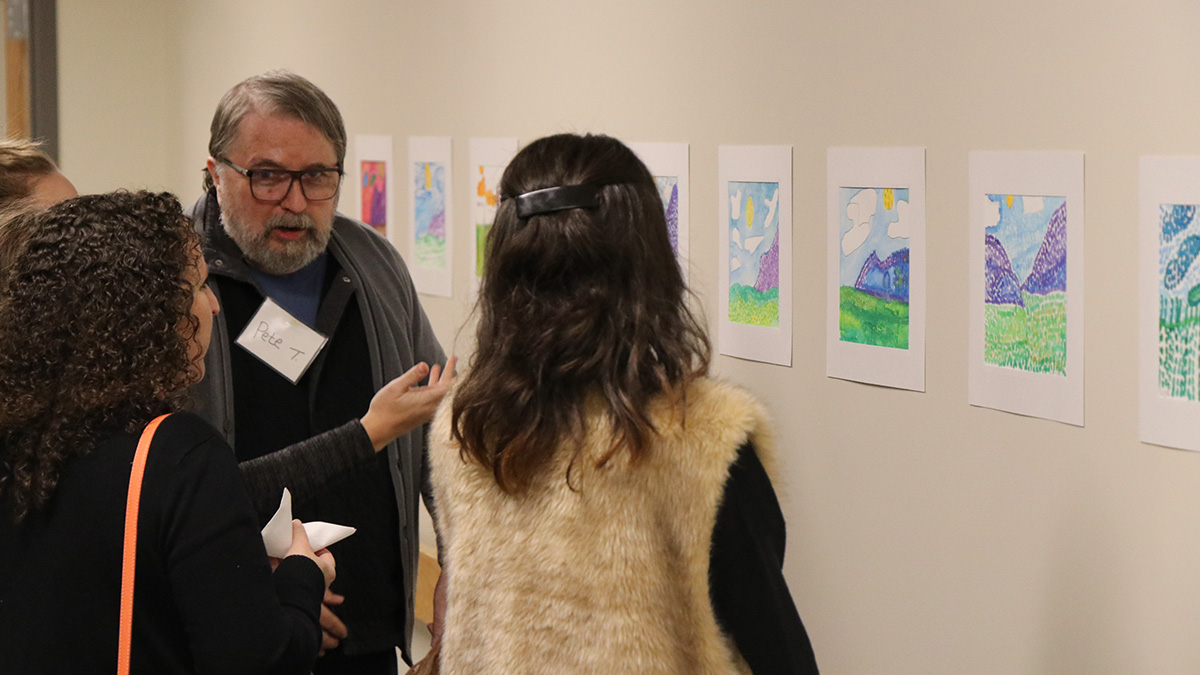 Pete, a participant in our Adult Day Program, shows off his artwork at the Adult Day Art Show