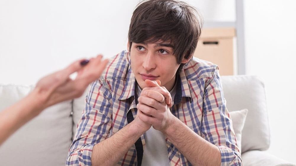 teen boy at psychologist