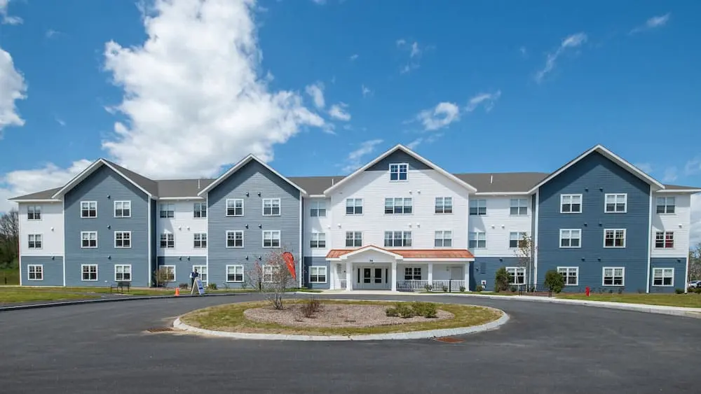 Front entrance view of Champlin Place housing facility located in Rochester, NH.