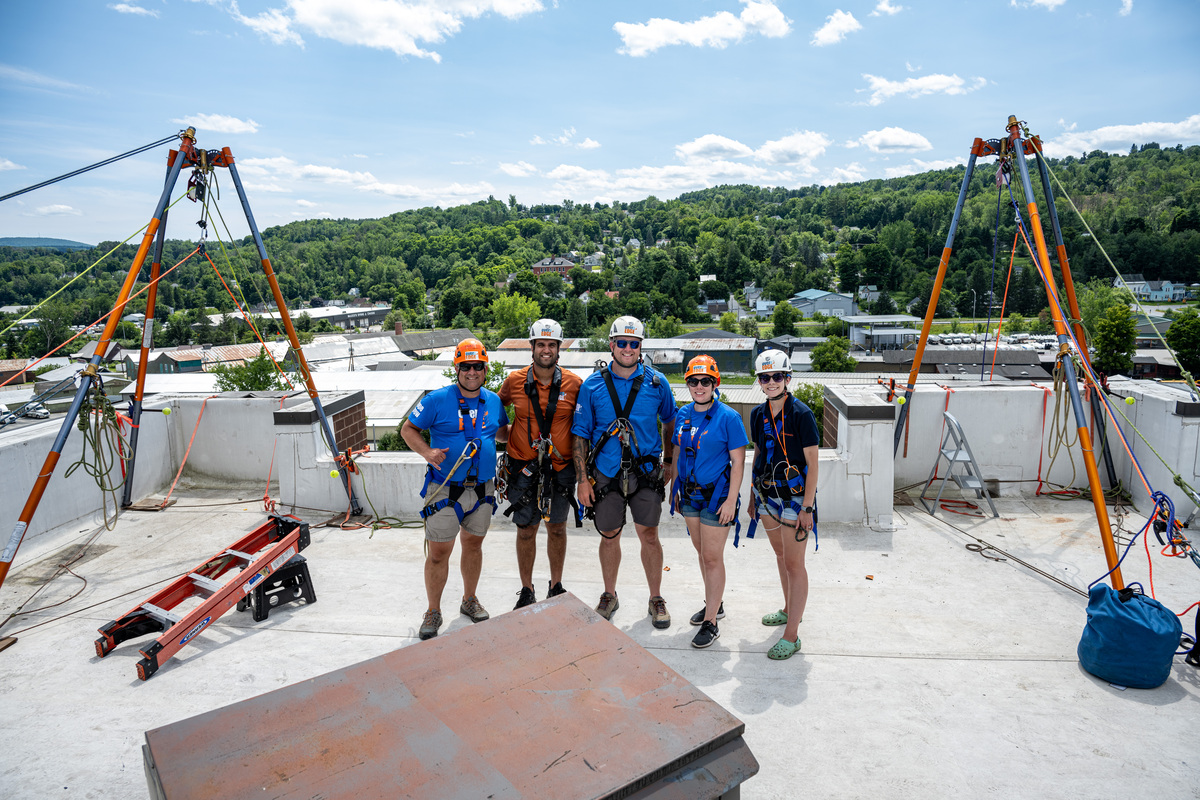 Pictured is the Over the Edge “rooftop team” at the end of the event after 31 people rappelled 11 stories