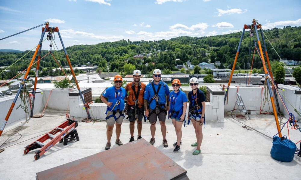 Photo of the Over the Edge and Easterseals NH & VT team on the Barre Manor roof.