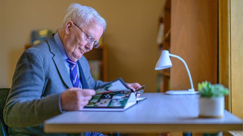 Mark Johnson, former VP of Easterseals VT reading a book at the Easterseals VT barre office.
 
