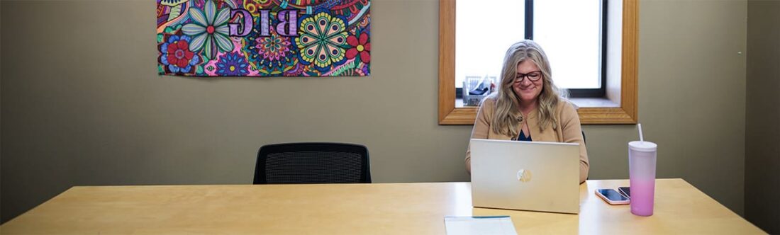 woman sitting at her desk in office