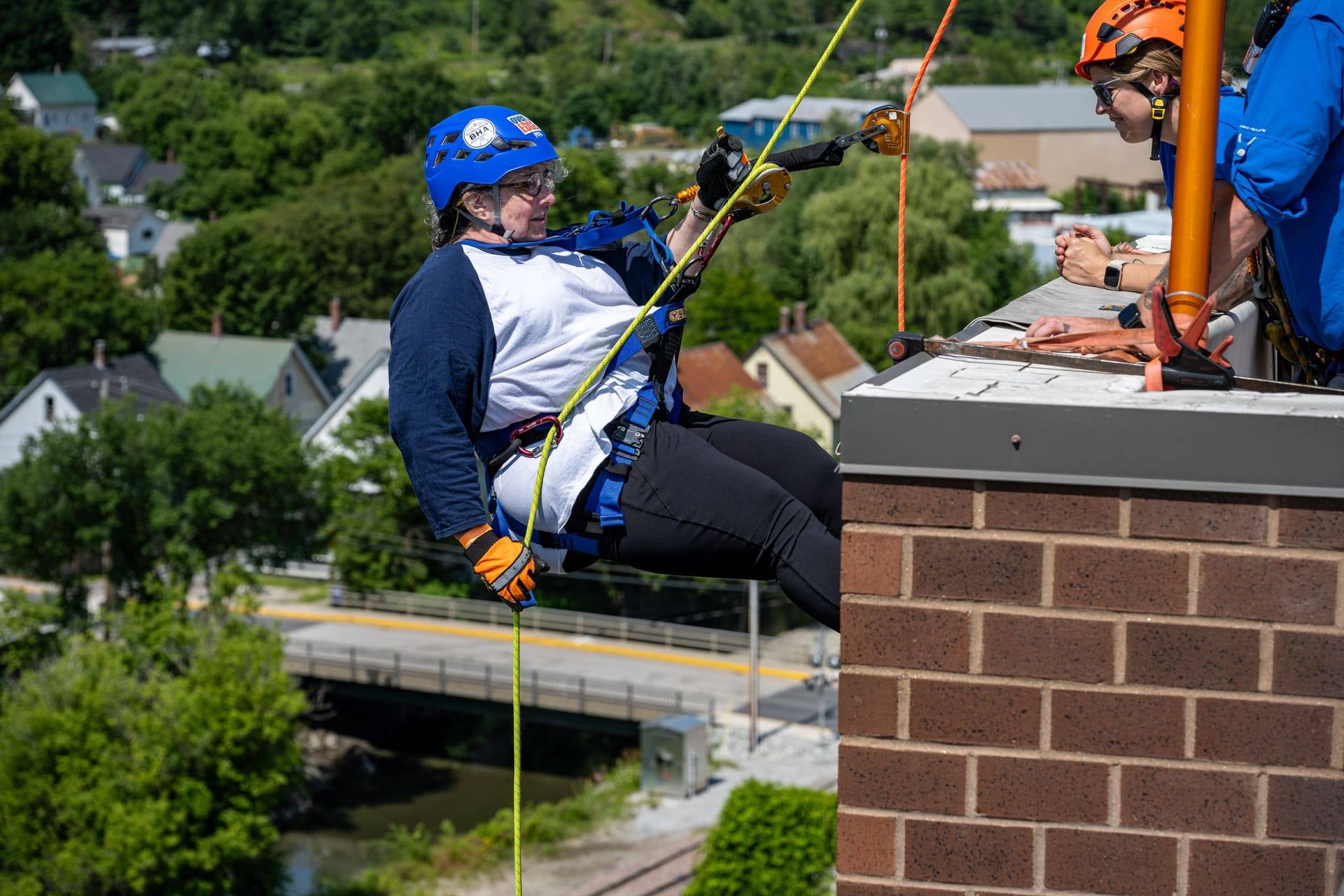 Person repelling at 2025 Easterseals VT Over the Edge event