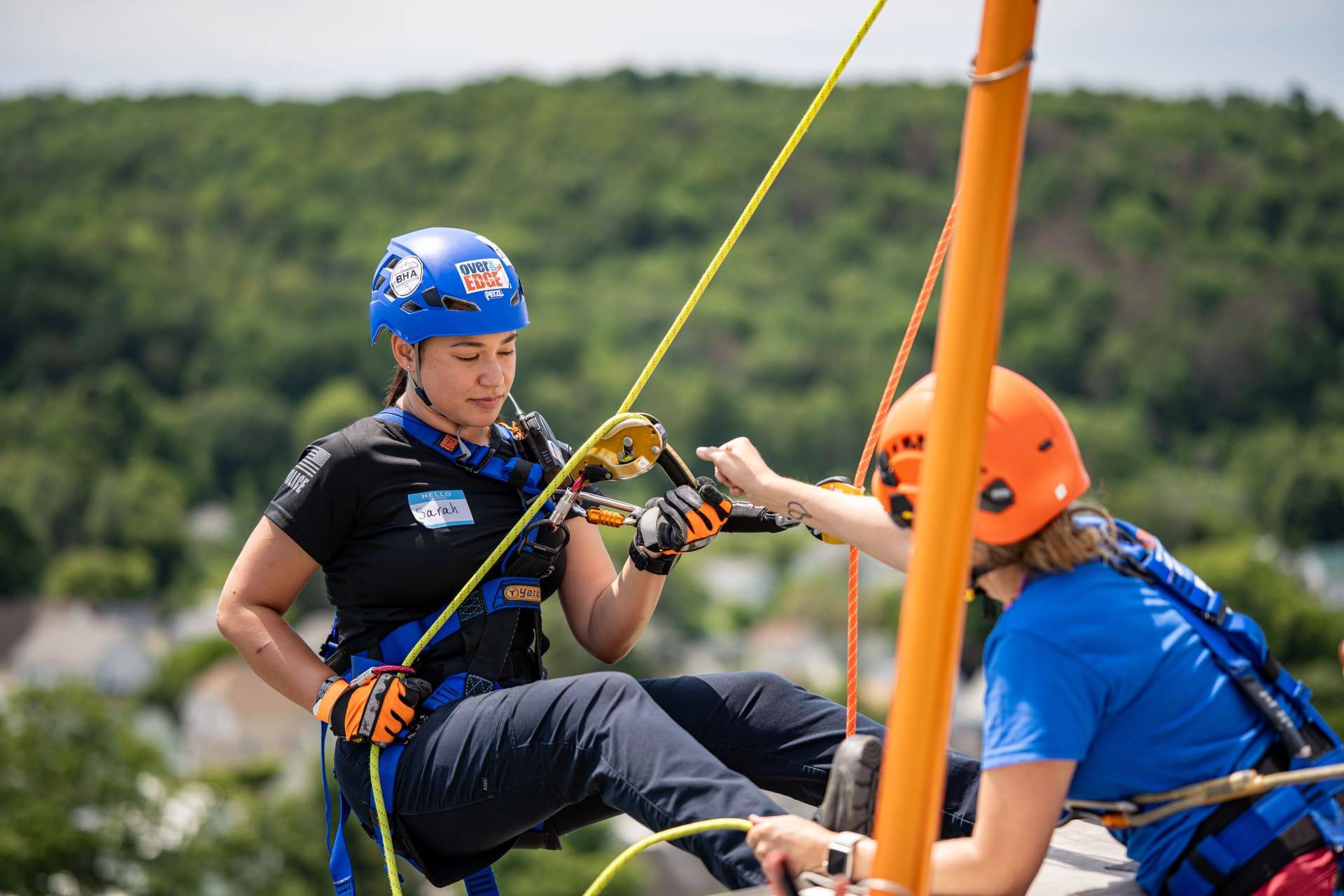 Person repelling at 2025 Easterseals VT Over the Edge event