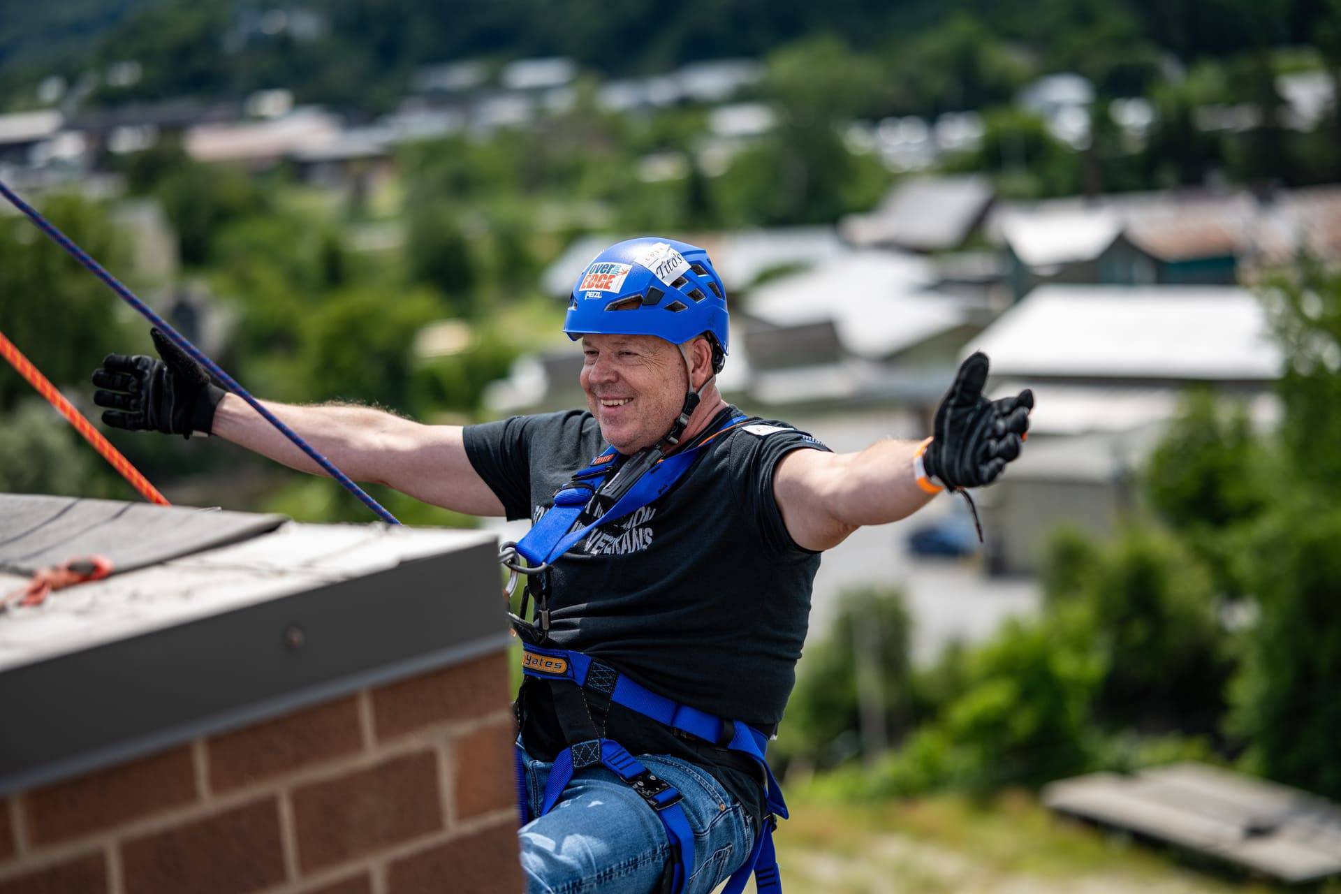 Person repelling at 2025 Easterseals VT Over the Edge event